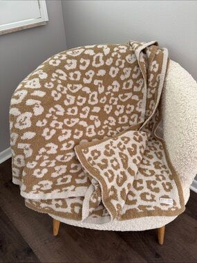 Barefoot Dreams In the Wild Print blanket in Tan and Cream animal print
